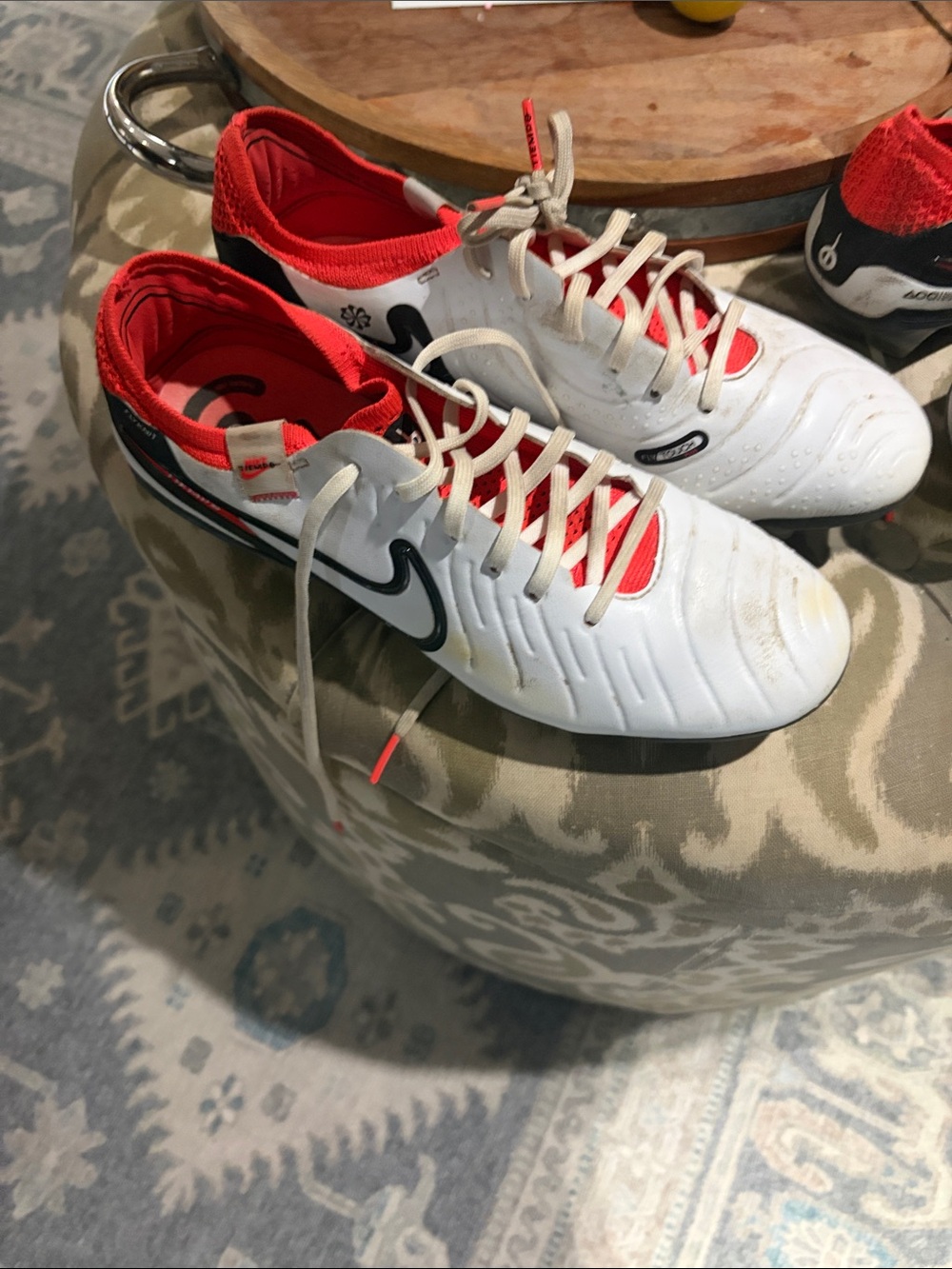 Nike White Soccer Cleats with Red Lining and Black Swoosh